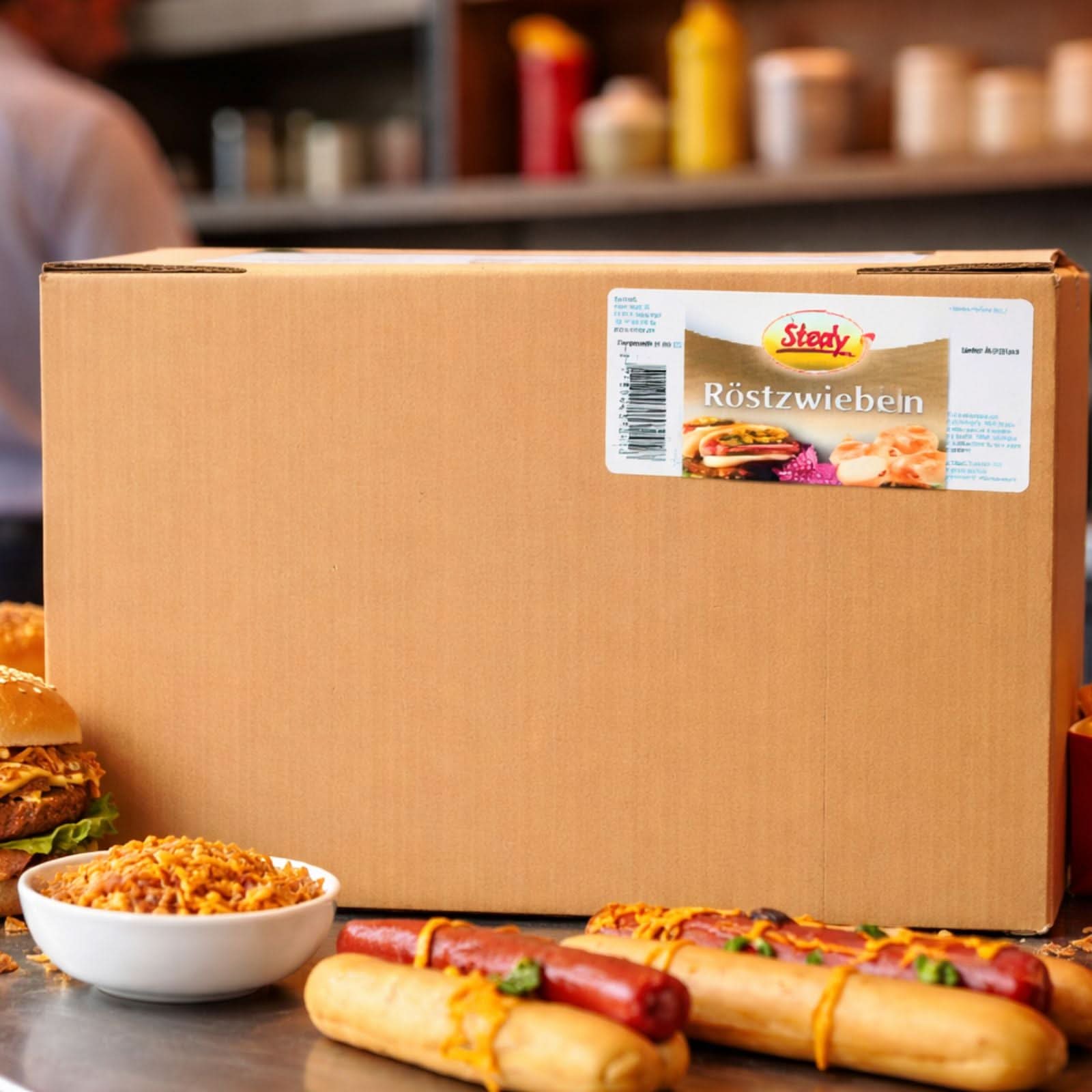 Stedy Röstzwiebeln im Karton mit Hotdogs und Beilagen daneben